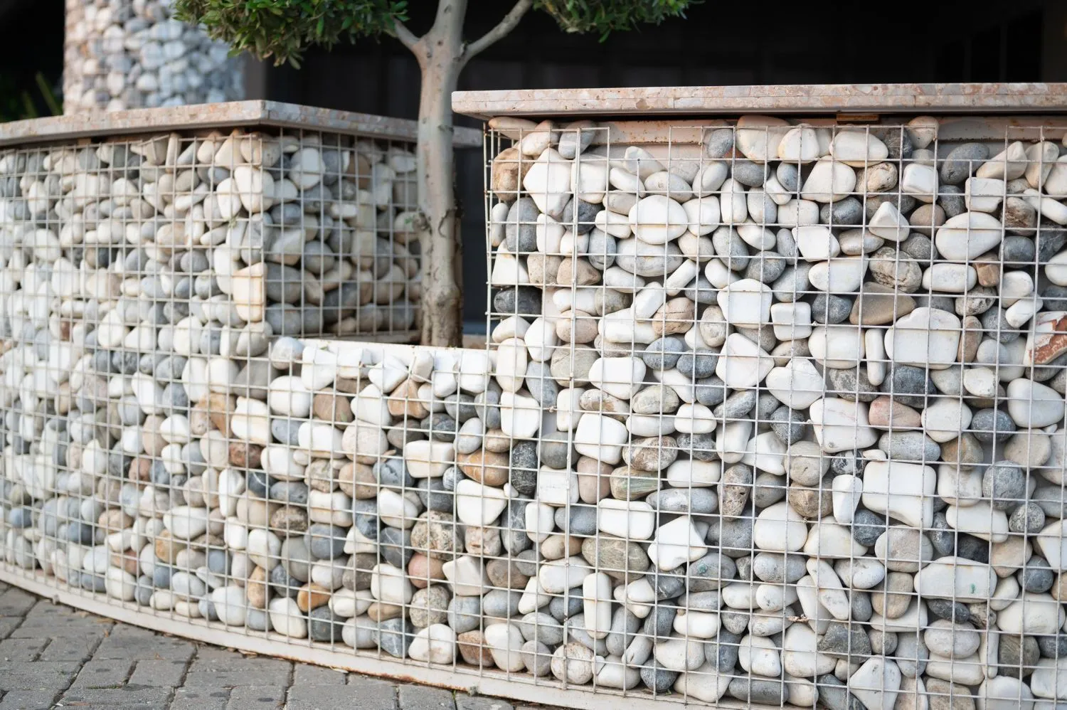 A fence made of rocks and wire.