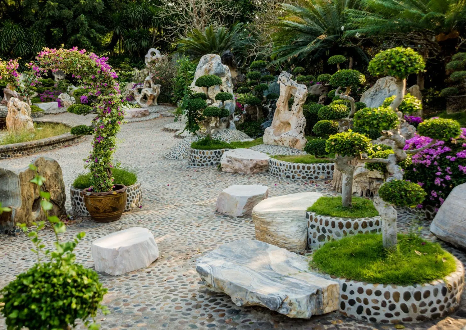 A garden filled with lots of plants and rocks.